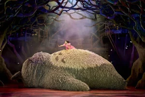 My Neighbour Totoral London Theatre photo of Mei on top of Totoro